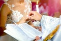 Newlyweds stand before the priest on a wedding ceremony and exchange the rings Royalty Free Stock Photo