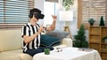 Excite white man playing online game with vr glasses at home Royalty Free Stock Photo