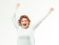 Excited adult woman with hands in the air Royalty Free Stock Photo