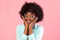 Excited African American Bushy Woman Looking At Camera Over Pink Background