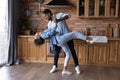 Excited African American couple dancing in kitchen, enjoying romantic date Royalty Free Stock Photo