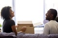 Excited African American couple unpacking belongings in new house Royalty Free Stock Photo