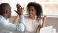 Excited african american family couple celebrating success. Royalty Free Stock Photo