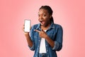 Excited African Lady Showing Phone Blank Screen Over Pink Background Royalty Free Stock Photo