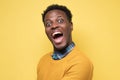 Excited african man stares at camera has stunned expression Royalty Free Stock Photo