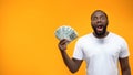 Excited Afro-American Man Holding Bunch Of Dollar, Crowd Funding Or Start-up