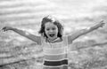 Excited amazed child on the green grass in summer park. Baby face closeup. Funny little kid boy close up portrait Royalty Free Stock Photo