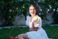 Excited amazed woman bitting apple, healthy lifestyle. Girls holds a fresh green apple outdoor portrait on spring park