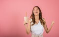 Excited Asian beautiful woman holding drinking brown sugar flavored tapioca pearl bubble milk tea Royalty Free Stock Photo