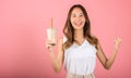 Excited Asian beautiful woman holding drinking brown sugar flavored tapioca pearl bubble milk tea Royalty Free Stock Photo