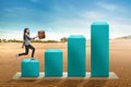 Excited asian business woman carrying briefcase walking to the top chart Royalty Free Stock Photo