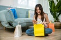 Excited Asian buying woman holding mobile phone with many shopping bags Royalty Free Stock Photo