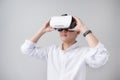 Excited asian man in a VR goggles and gesturing with his hands Royalty Free Stock Photo