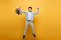 Excited asian schoolboy holding backpack and Royalty Free Stock Photo