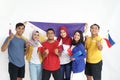 Excited asian young supporter holding philippine flag