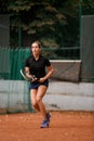 excited athletic woman tennis player with racket in her hands on tennis court Royalty Free Stock Photo