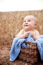 Excited baby in basket