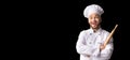 Excited Baker Posing With Dough Rolling Pin Over Black Background Royalty Free Stock Photo