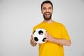 excited bearded football fan in yellow Royalty Free Stock Photo