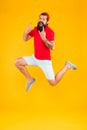 Excited bearded man jumping. full of energy. Impetuous movement. dedicated to sport and fitness. active runner in move