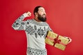 excited bearded man in winter sweater