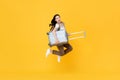 Excited beautiful Asian woman tourist jumping with luggage Royalty Free Stock Photo