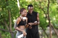 Excited Black Couple Checking Burned Callories After Training Outdoors With Smartphone App Royalty Free Stock Photo