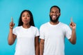 Excited black couple have great idea and pointing up Royalty Free Stock Photo