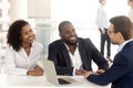 Excited black couple speak with realtor buying property together