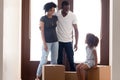 Excited black family moving to new home with daughter Royalty Free Stock Photo