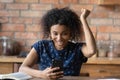 Excited black lady receive invitation on attractive event by phone