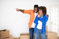 Excited black man surprising his wife with moving to new home Royalty Free Stock Photo