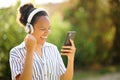 Excited black woman celebrating listening to music Royalty Free Stock Photo