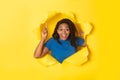 Excited Black Woman Pointing Finger Up Posing In Torn Paper Royalty Free Stock Photo