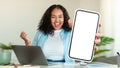 Excited Black Woman Sitting At desk With laptop And Showing Blank Smartphone Royalty Free Stock Photo