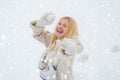 Excited blond hair girl i winter clothes outdoor. Beautiful winter woman laughing outdoors. Beauty Joyful Girl having Royalty Free Stock Photo