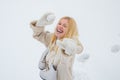 Excited blond hair girl i winter clothes outdoor. Beautiful winter woman laughing outdoors. Beauty Joyful Girl having Royalty Free Stock Photo