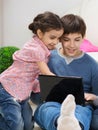 Excited bother and sister with laptop Royalty Free Stock Photo