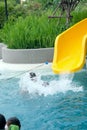 Excited boy having fun on water slide Royalty Free Stock Photo