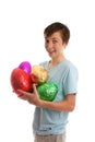 Excited boy holding chocolate easter eggs