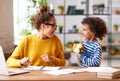 Excited boy little son greeting his mom with Mothers day and giving her spring flower bouquet Royalty Free Stock Photo