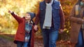 Excited Boy Ponting On Family Autumn Walk Through Countryside With Parents Royalty Free Stock Photo