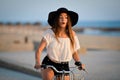 Excited brunette in black floppy hat holding Royalty Free Stock Photo