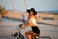 Excited brunette in black floppy hat holding Royalty Free Stock Photo