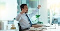 Excited business man cheering at his desk. Successful male banker or happy financial advisor celebrating his trading Royalty Free Stock Photo