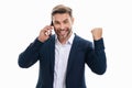 Excited business man talking on phone. Business man in suit using smart phone isolated over studio background. Portrait Royalty Free Stock Photo