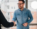 Excited business professionals sealing and closing successful deal with handshake at office Royalty Free Stock Photo