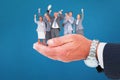 Composite image of excited business team cheering at camera with trophy Royalty Free Stock Photo