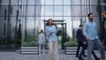 Excited business woman celebrating promotion in contemporary glass office facade Royalty Free Stock Photo