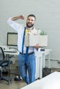 Businessman with cardboard box in hand quitting job